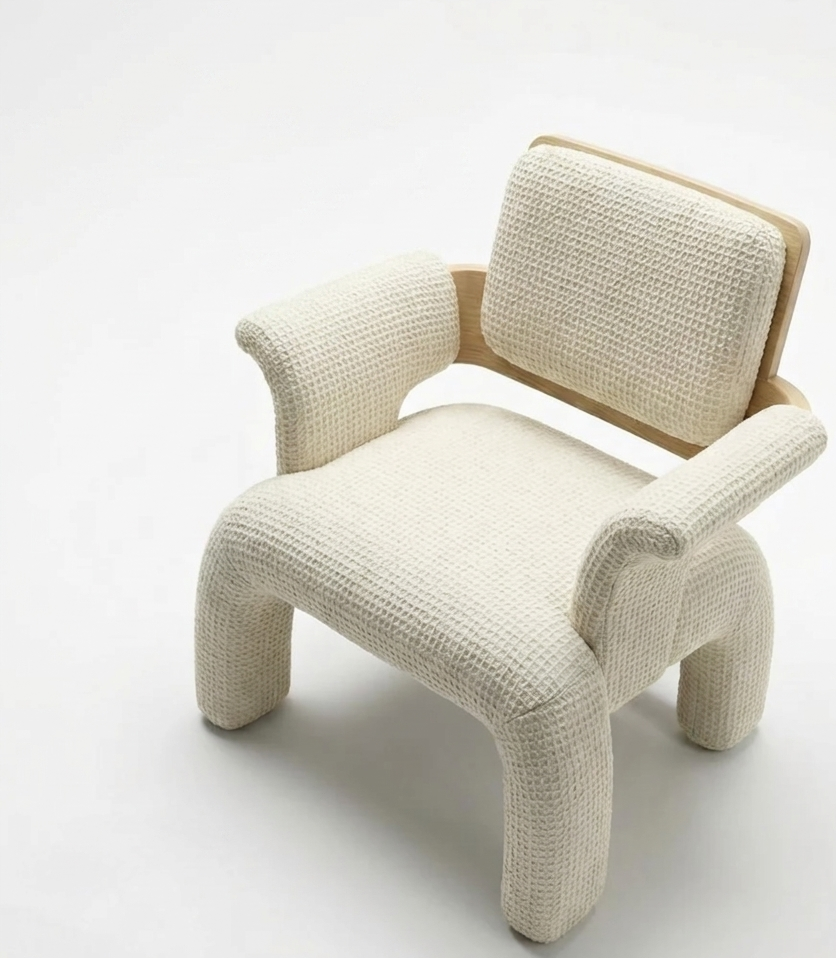 Aria Armchair in cream waffle-weave fabric on a natural oak frame